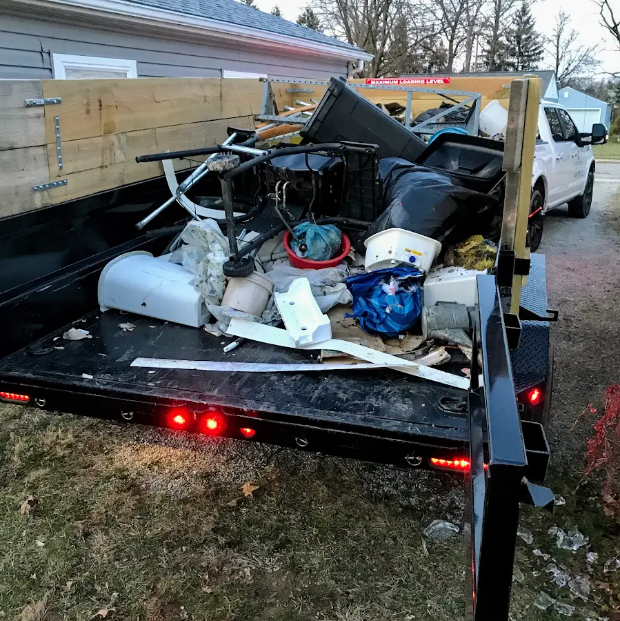 Roll-off dumpster delivered to a residential driveway in Hampden